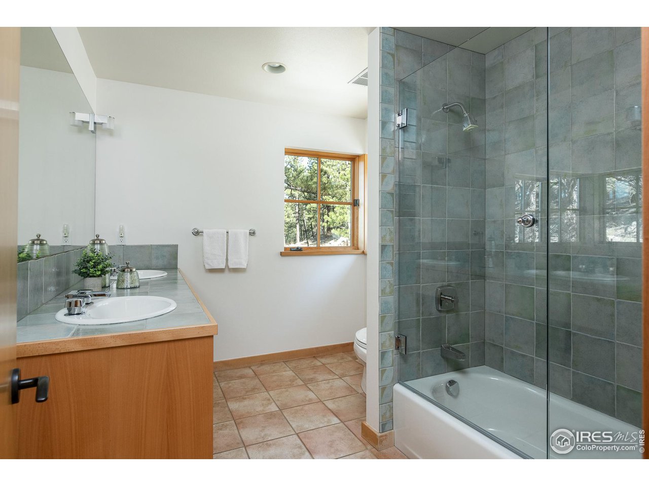 2358 Sunshine Canyon Drive Boulder, CO 80302 - Photo 24 of 36 a bathroom with a sink shower and a mirror