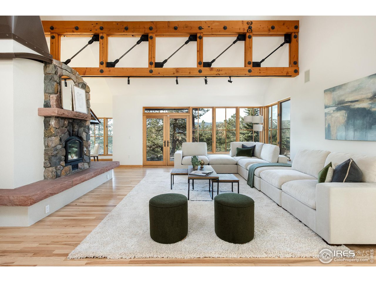 2358 Sunshine Canyon Drive Boulder, CO 80302 - Photo 5 of 36 a living room with furniture a rug and a large window