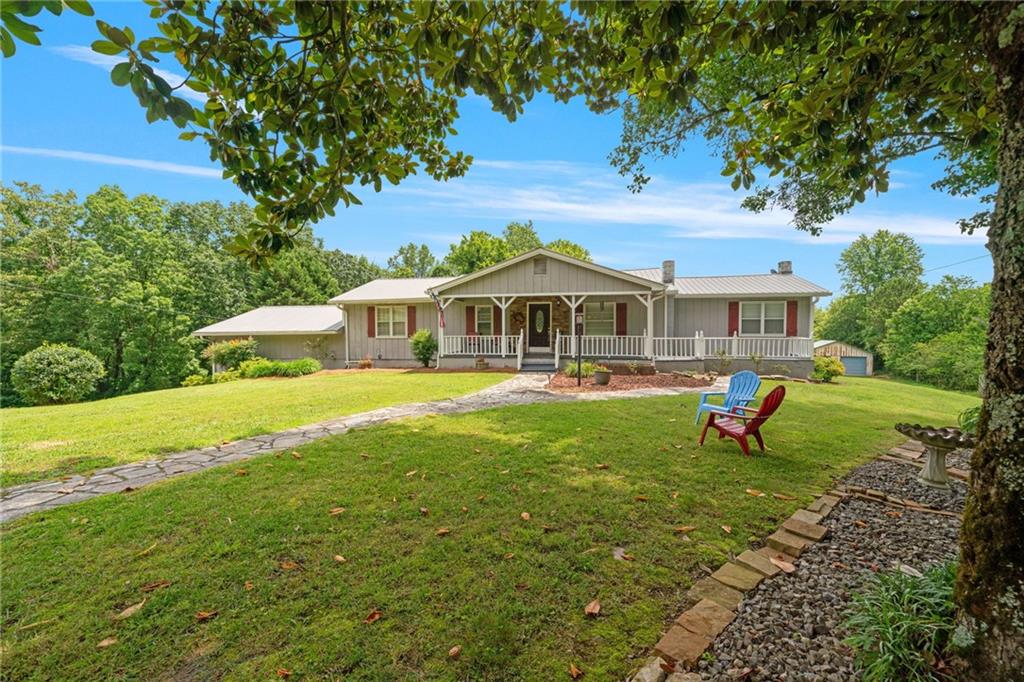 a front view of a house with garden