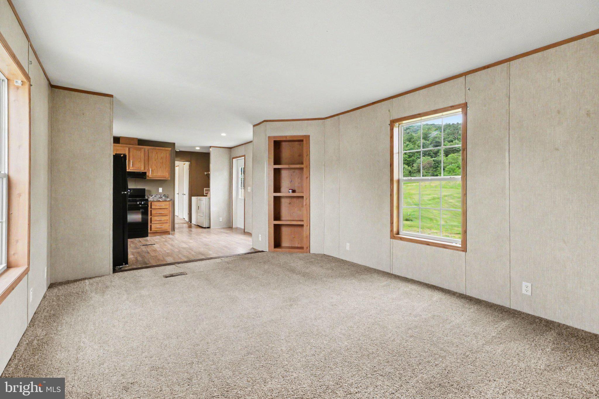 66 Kip Road Halifax, PA 17032 - Photo 4 of 16 a view of empty room with furniture and a window