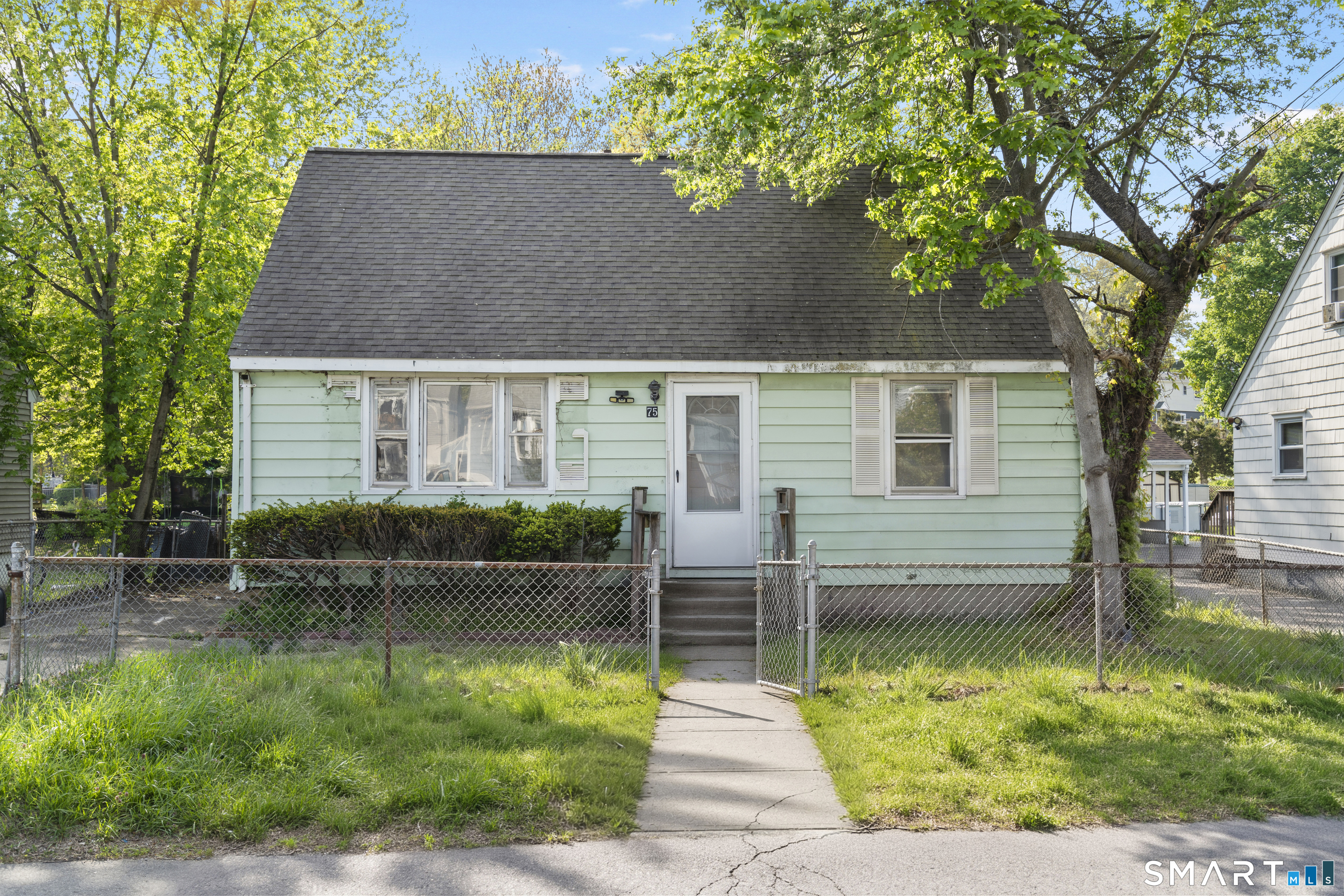 75 Brookside Avenue Bridgeport, CT 06606 - Photo 1 of 24 a balcony view with a garden