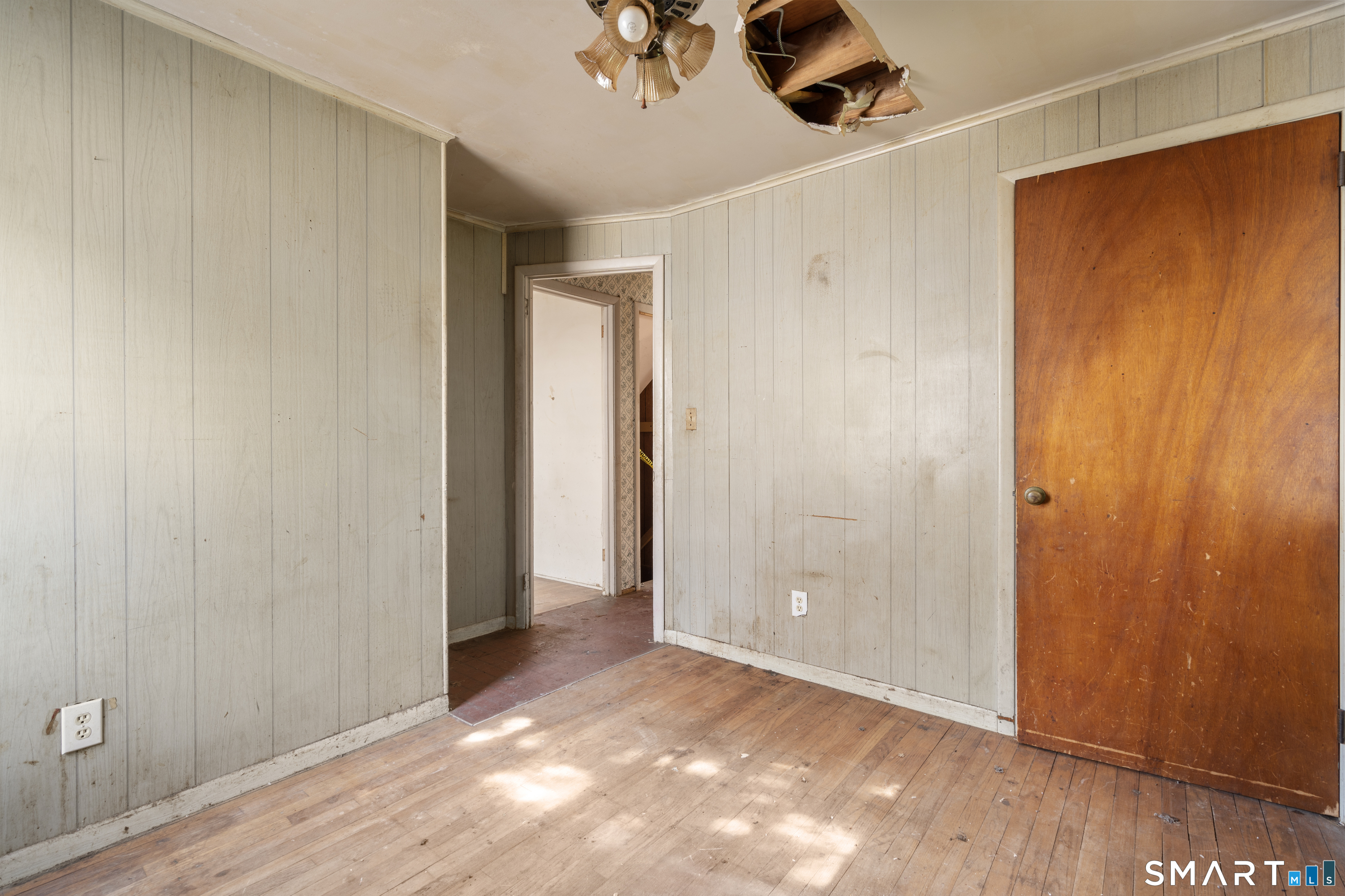 75 Brookside Avenue Bridgeport, CT 06606 - Photo 12 of 24 wooden floor in an empty room with a window