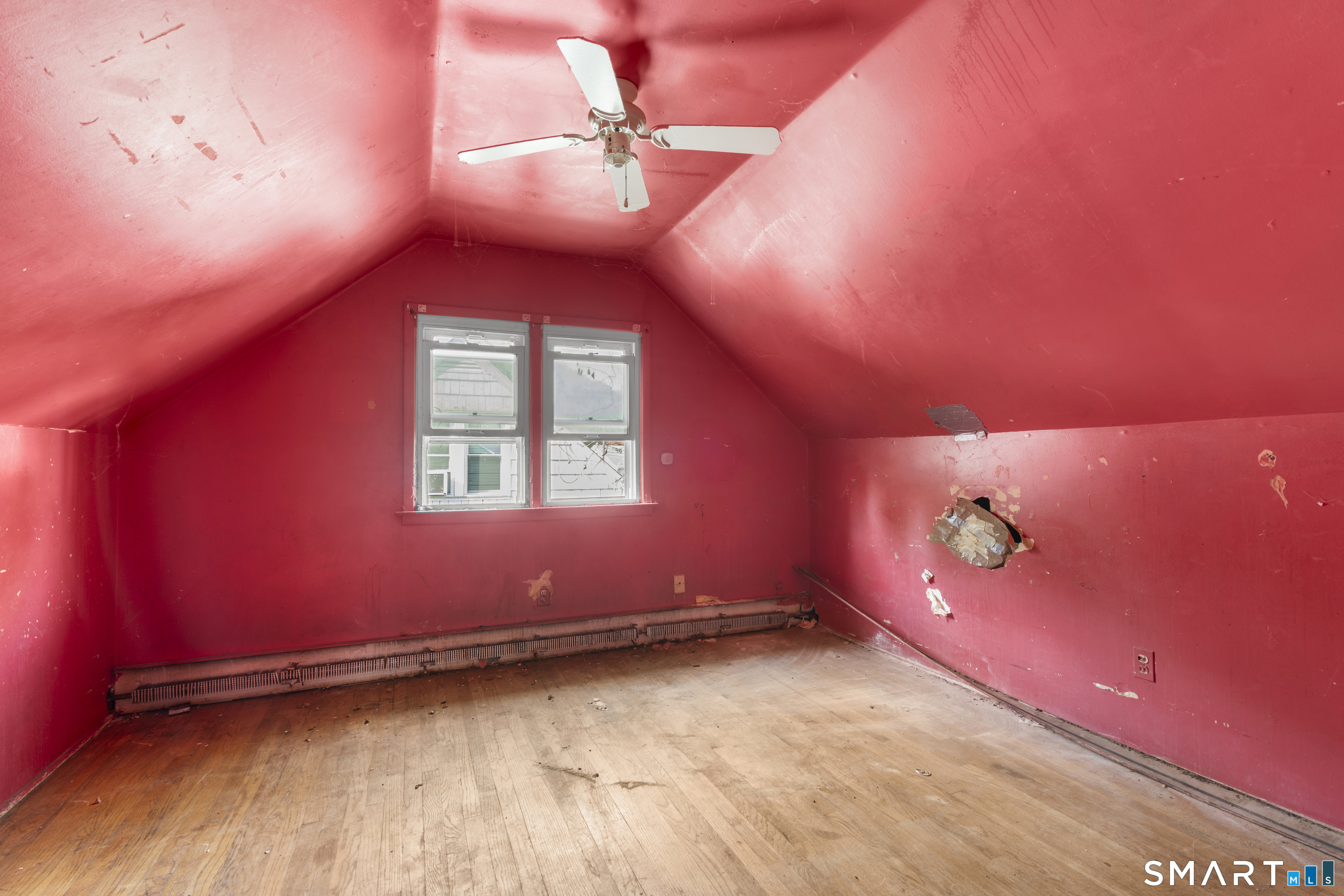 75 Brookside Avenue Bridgeport, CT 06606 - Photo 17 of 24 a view of a room with a large window and a ceiling fan