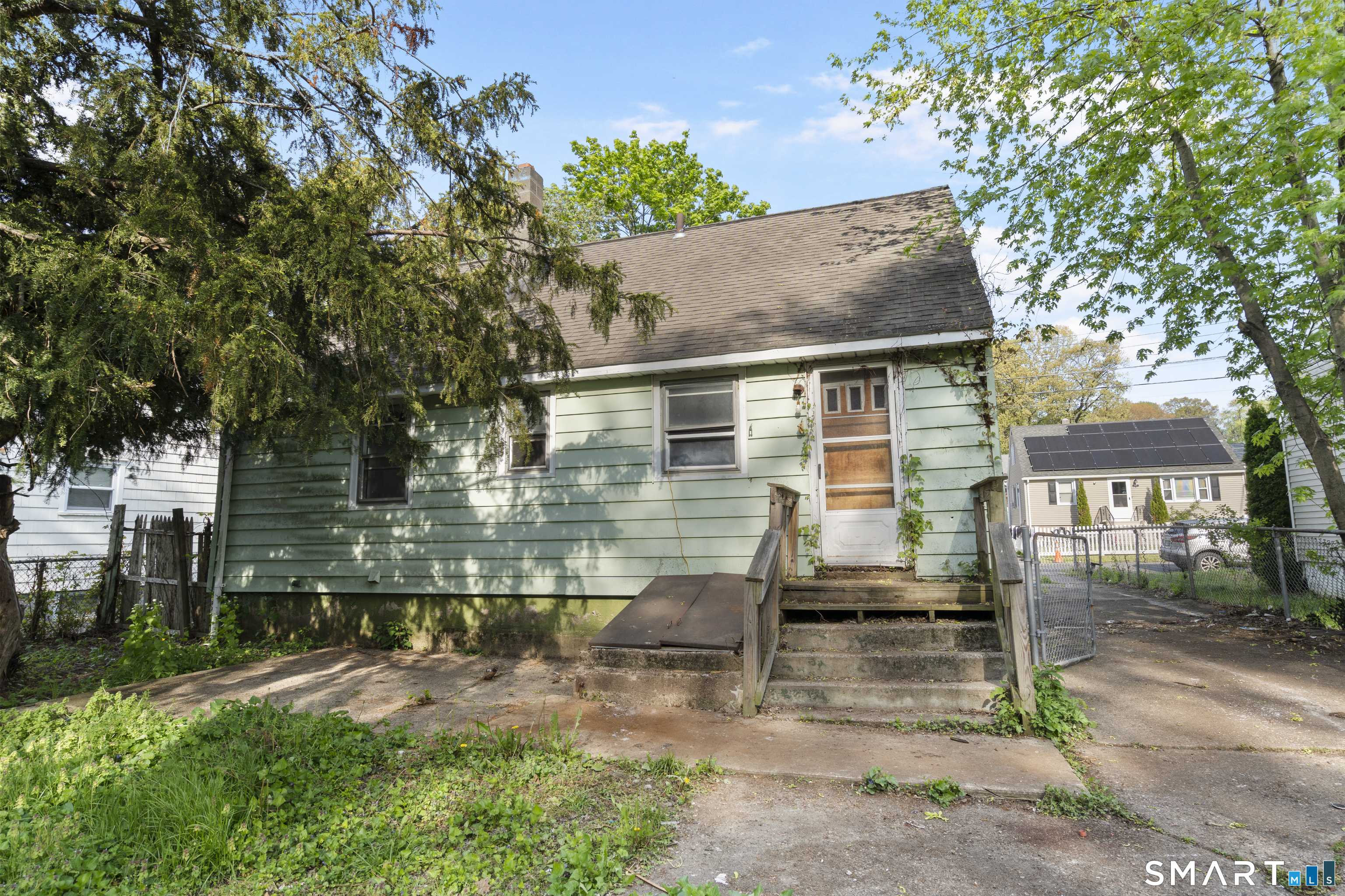 75 Brookside Avenue Bridgeport, CT 06606 - Photo 20 of 24 front view of house with a yard