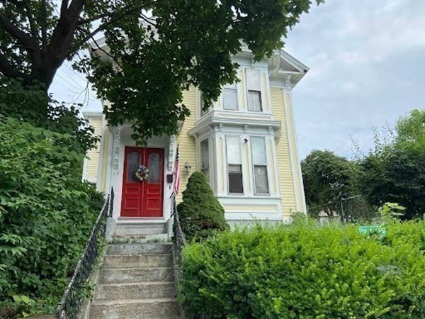 a front view of a house with a yard