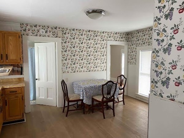 15 Varney Street Lowell, MA 01854 - Photo 14 of 32 a view of a dining room with furniture and chandelier