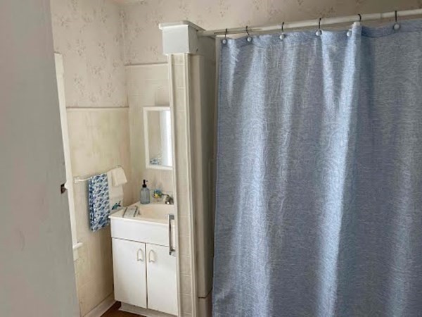 15 Varney Street Lowell, MA 01854 - Photo 15 of 32 a bathroom with a sink toilet and shower