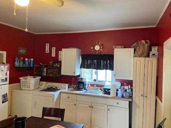 15 Varney Street Lowell, MA 01854 - Photo 21 of 32 a kitchen with a sink and cabinets