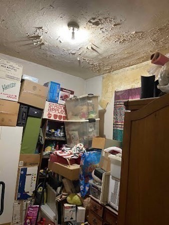 15 Varney Street Lowell, MA 01854 - Photo 23 of 32 a view of a room that has a couch and chair in it