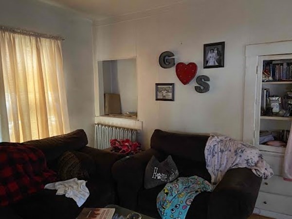 15 Varney Street Lowell, MA 01854 - Photo 31 of 32 a living room with furniture and a window