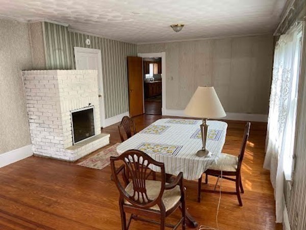 15 Varney Street Lowell, MA 01854 - Photo 6 of 32 a view of a dining room with furniture and wooden floor