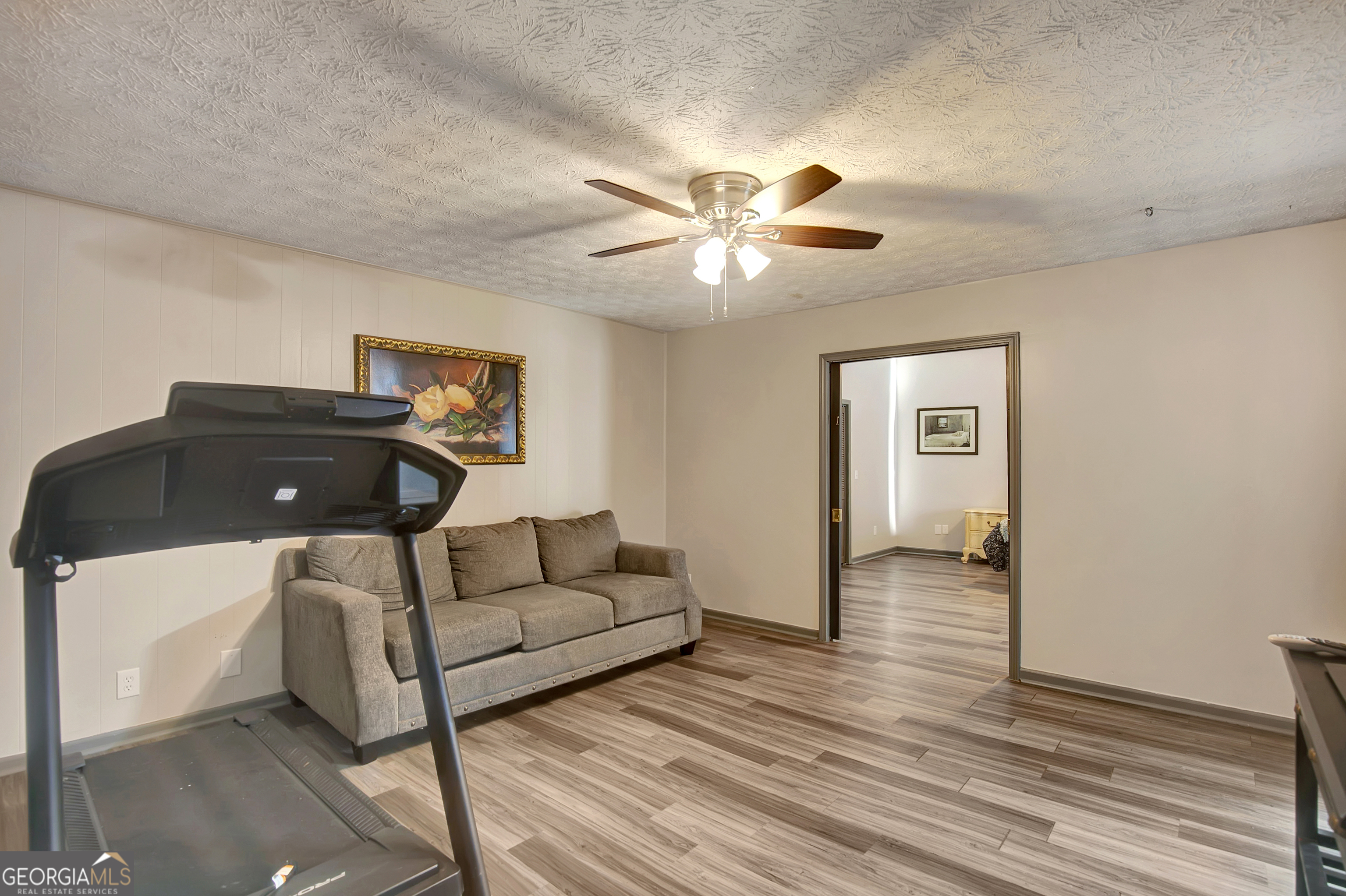 1188 Raymond Hill Road Newnan, GA 30265 - Photo 23 of 47 a living room with furniture and a ceiling fan