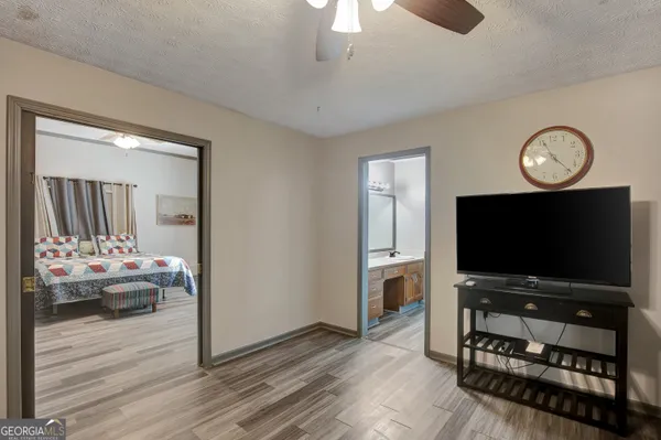 a living room with furniture and a flat screen tv
