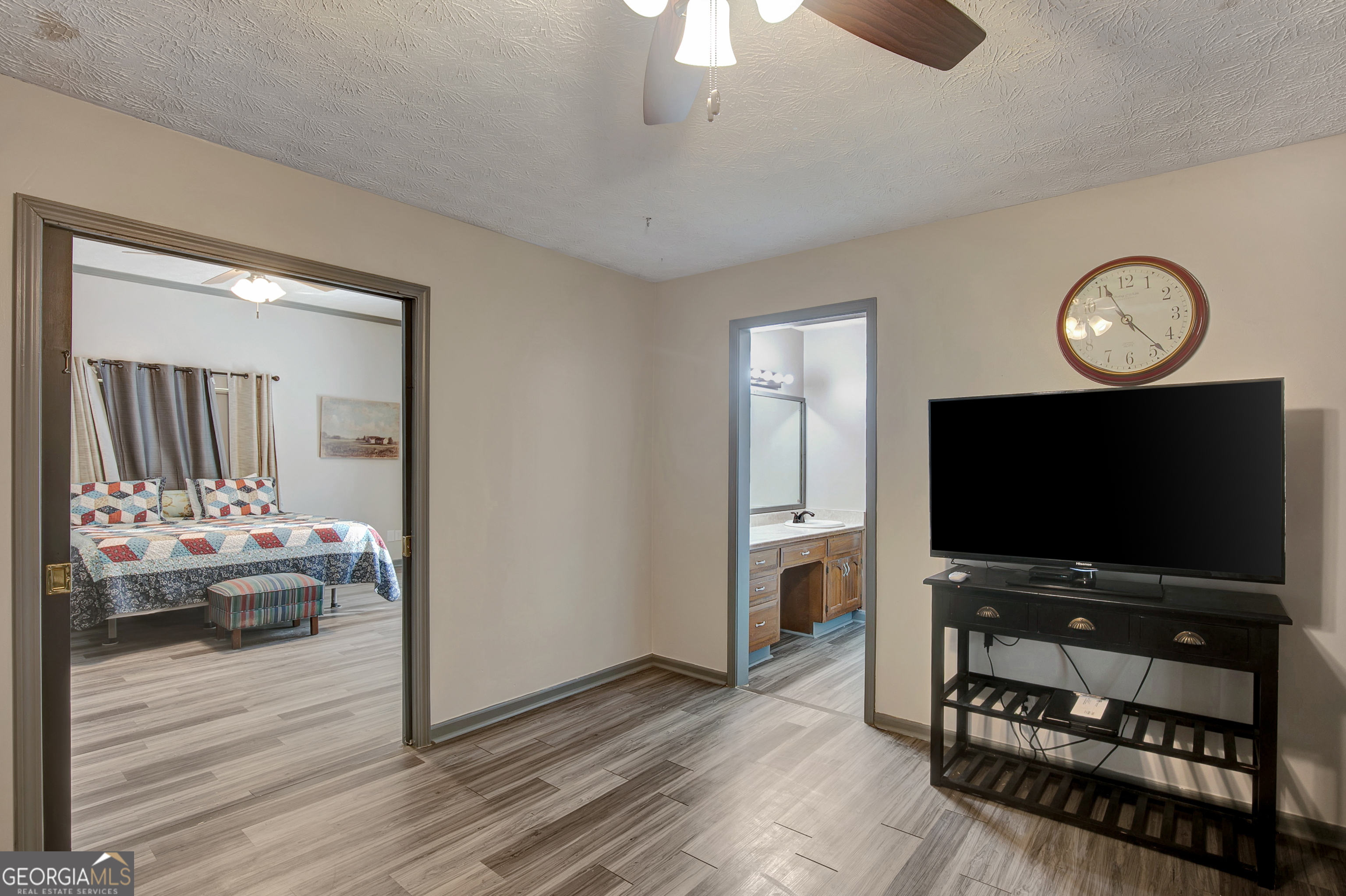 1188 Raymond Hill Road Newnan, GA 30265 - Photo 24 of 47 a living room with furniture and a flat screen tv