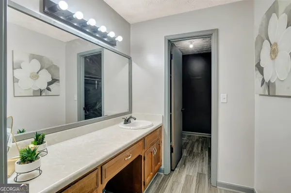 a bathroom with a sink double vanity and a mirror