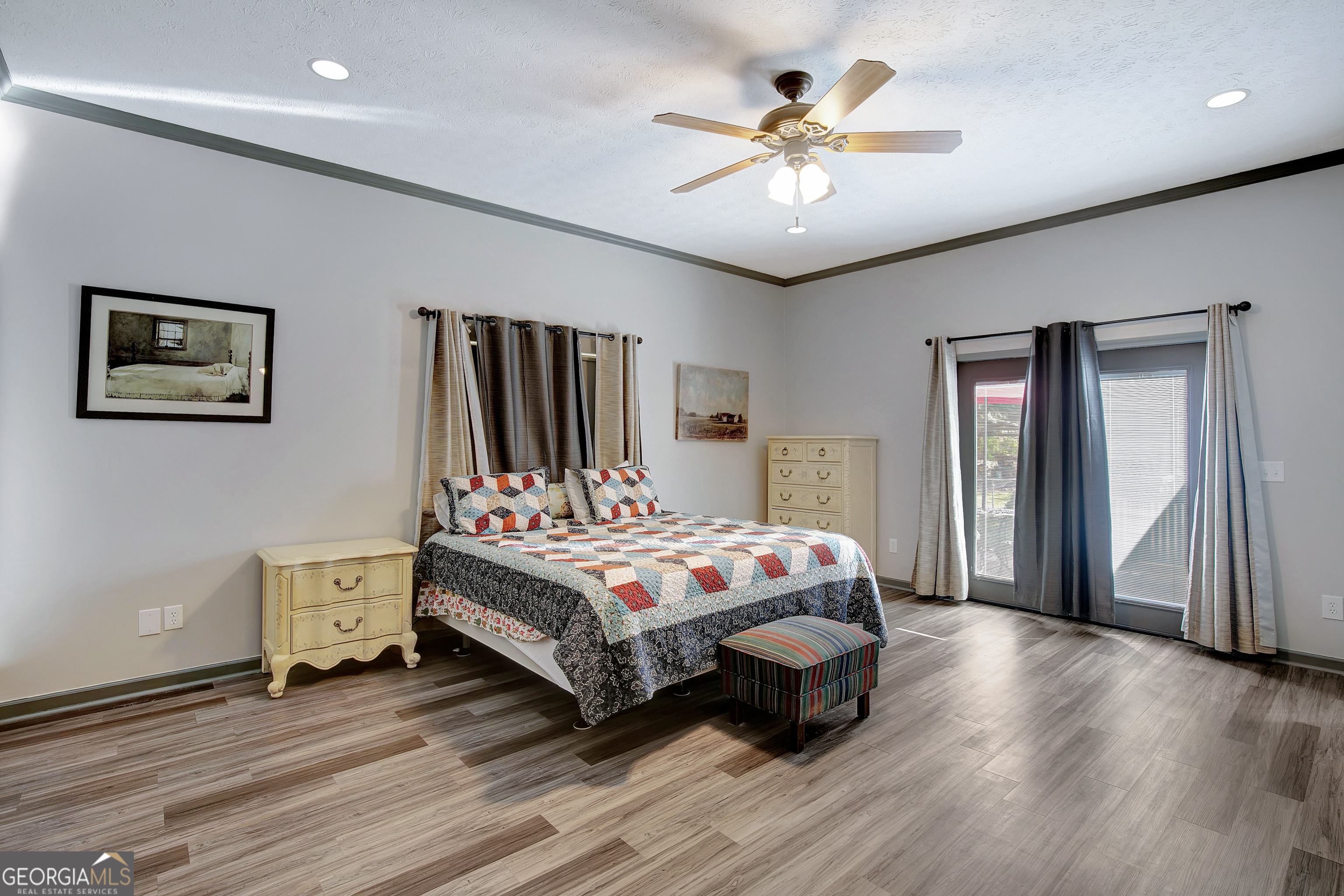 1188 Raymond Hill Road Newnan, GA 30265 - Photo 27 of 47 a bedroom with a bed and a chandelier