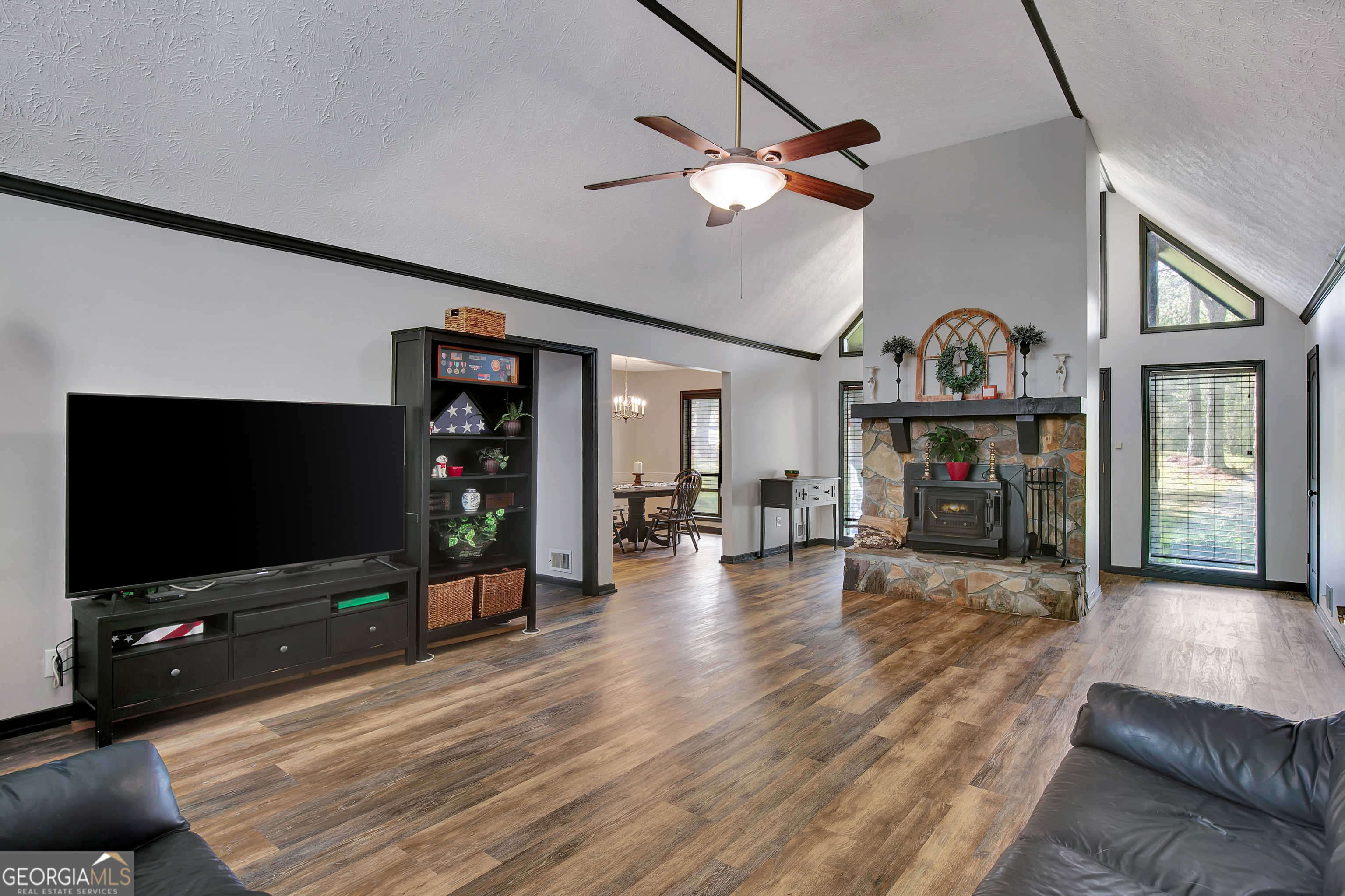 1188 Raymond Hill Road Newnan, GA 30265 - Photo 8 of 47 a living room with furniture and a flat screen tv