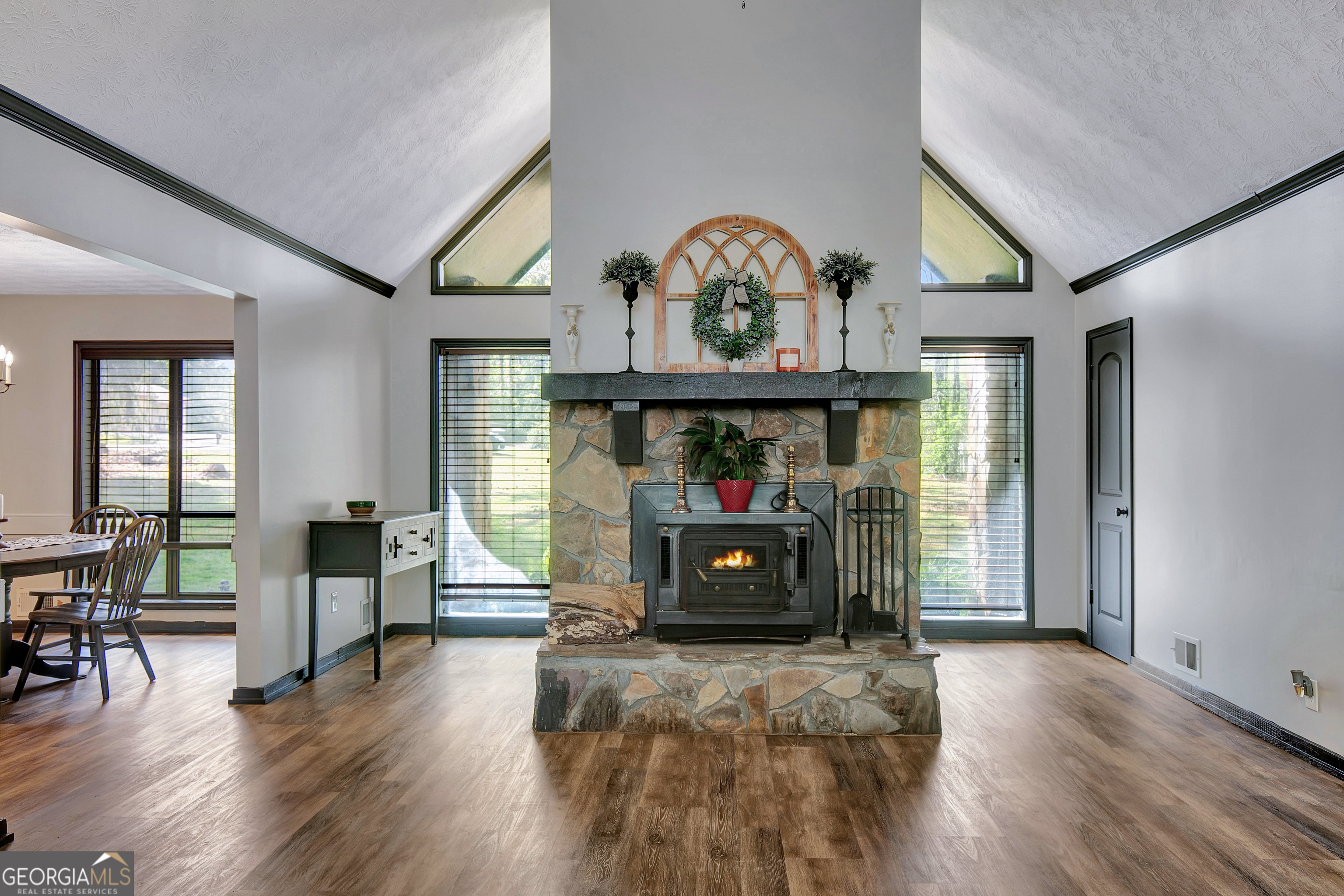 1188 Raymond Hill Road Newnan, GA 30265 - Photo 9 of 47 a view of a livingroom with wooden floor and furniture