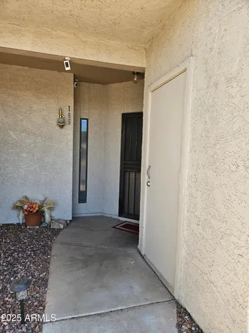 a kitchen with refrigerator cabinets and wooden floor
