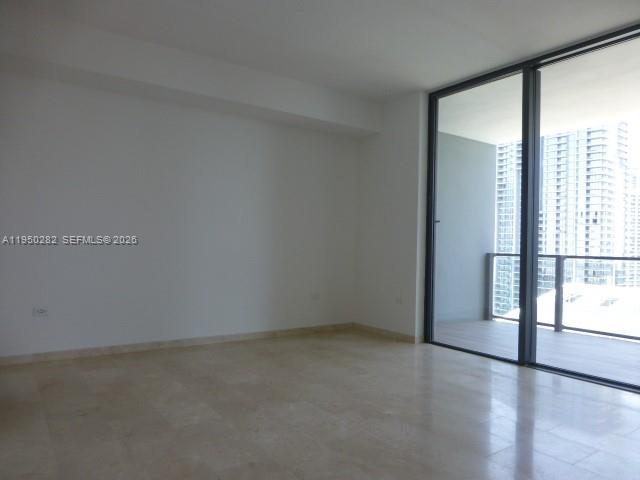 88 Southwest 7th Street, Unit 2203 Miami, FL 33130 - Photo 17 of 37 a view of an empty room with a window