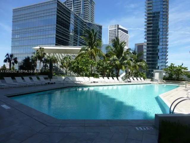 a view of swimming pool from a balcony