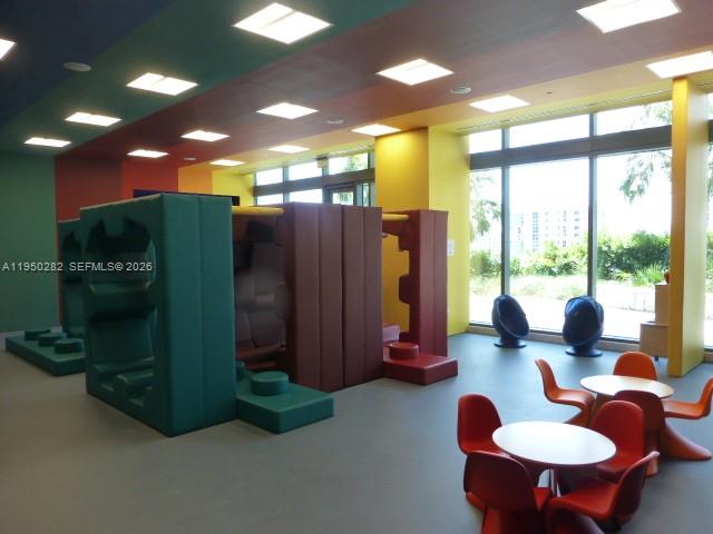 88 Southwest 7th Street, Unit 2203 Miami, FL 33130 - Photo 28 of 37 a dinning room with furniture and a large window