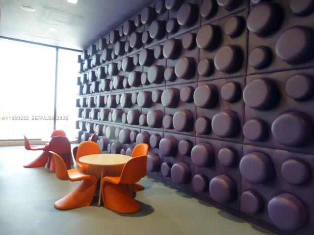88 Southwest 7th Street, Unit 2203 Miami, FL 33130 - Photo 29 of 37 a view of a chairs and table in a room