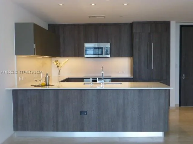 a view of a kitchen with a sink