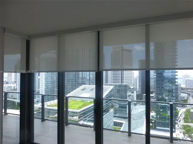 a view of a living room and balcony