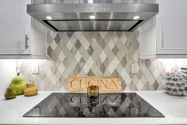 a view of a dining room with furniture a chandelier and wooden floor