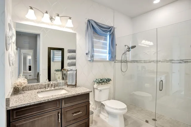 a view of a a dining room with furniture window and wooden floor