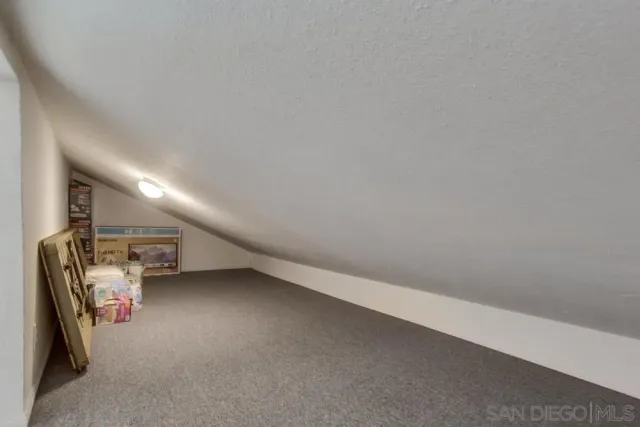 an empty room with windows and entrance