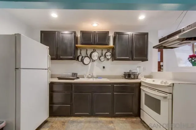 a bathroom with a toilet a sink and a mirror