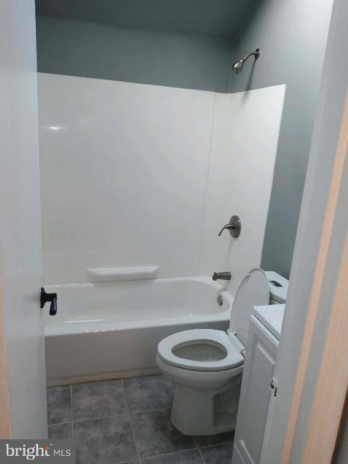 12616 Epping Road Silver Spring, MD 20906 - Photo 18 of 28 a white toilet sitting next to a bath tub