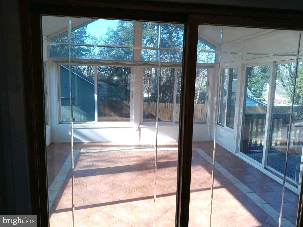 12616 Epping Road Silver Spring, MD 20906 - Photo 20 of 28 a view of a glass door with a balcony from a window