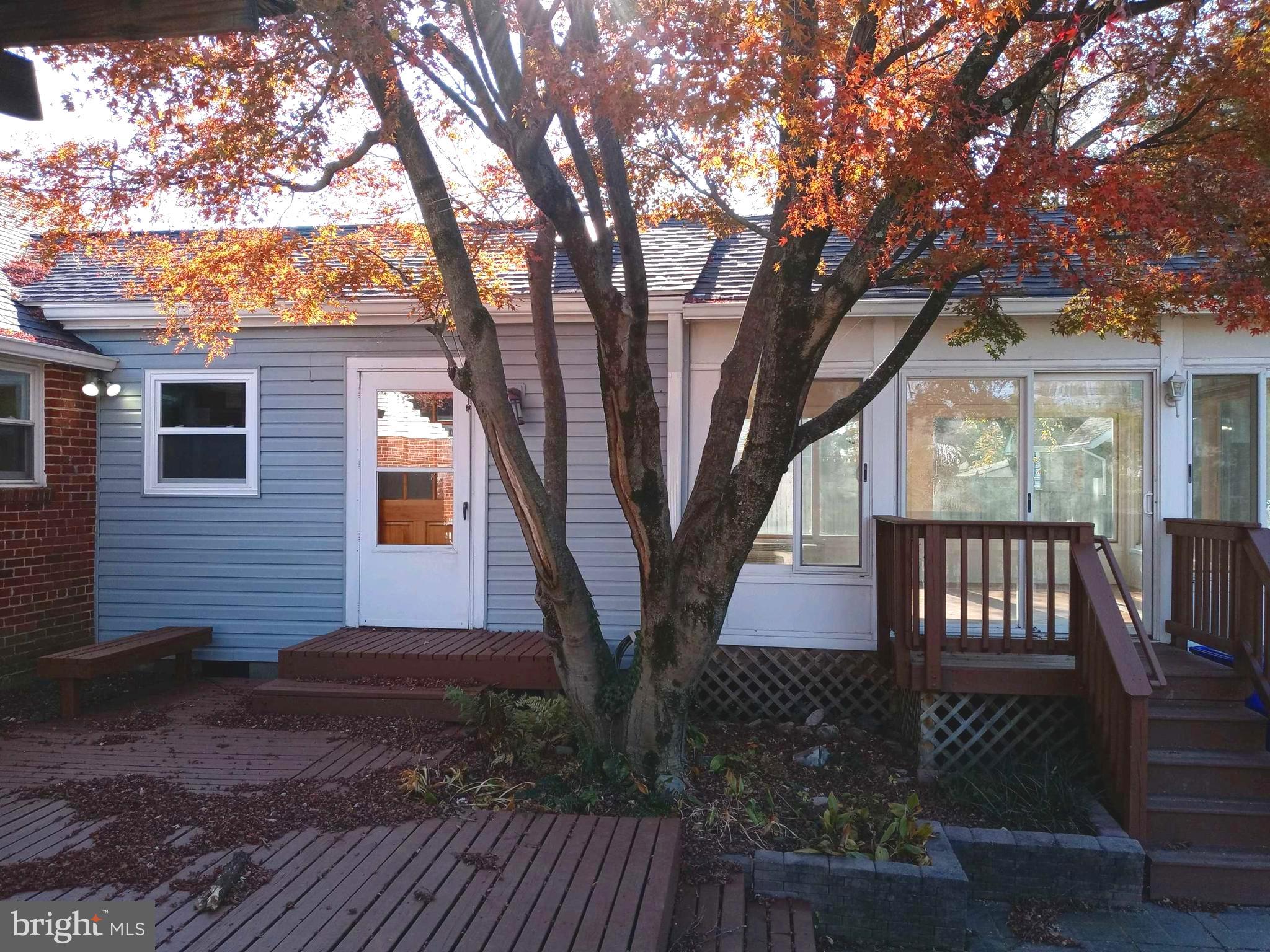 12616 Epping Road Silver Spring, MD 20906 - Photo 24 of 28 a view of backyard with roof deck and wooden floor