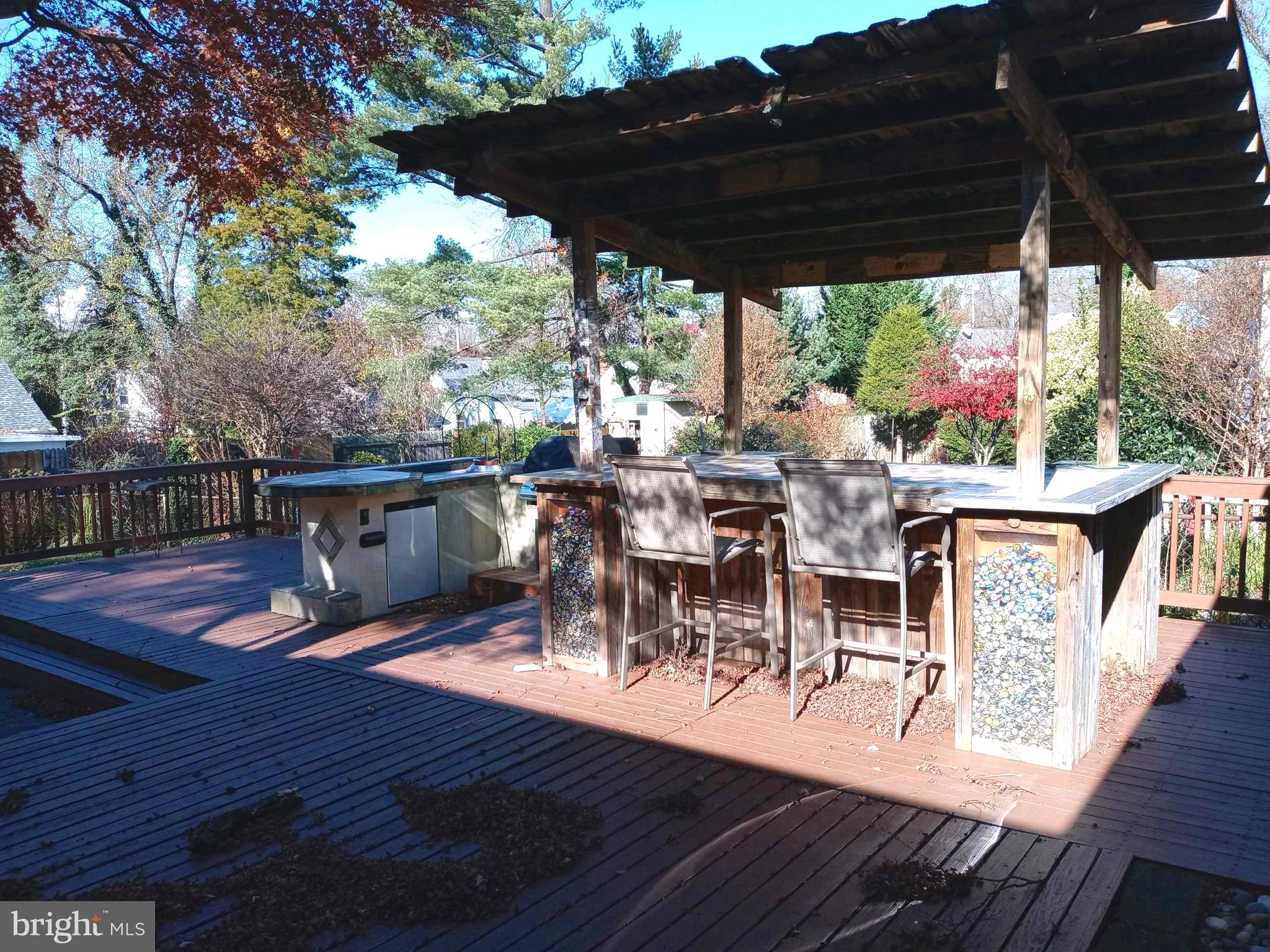 12616 Epping Road Silver Spring, MD 20906 - Photo 25 of 28 a view of a patio with wooden floor a yard tables and chairs