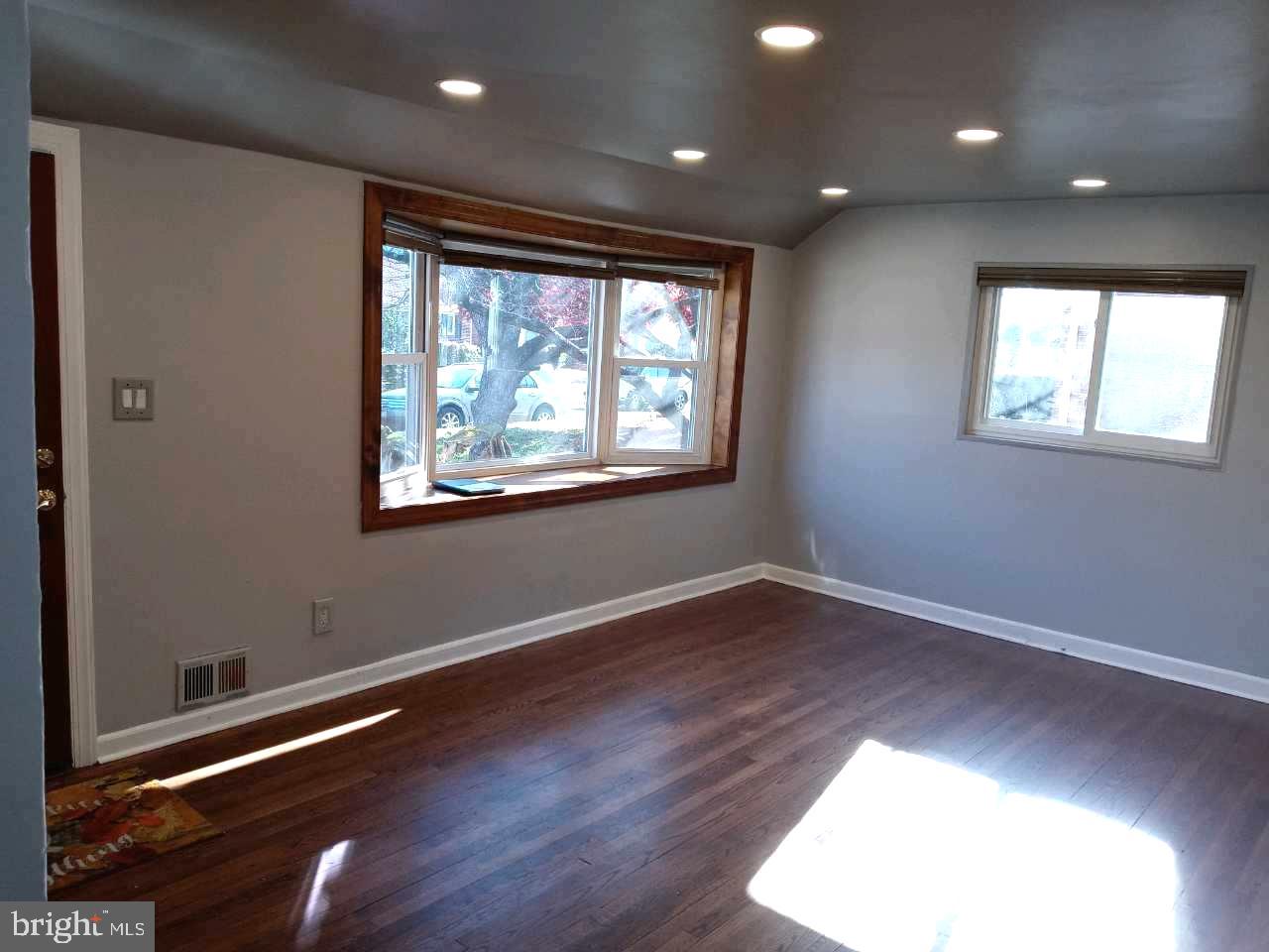 12616 Epping Road Silver Spring, MD 20906 - Photo 4 of 28 an empty room with wooden floor and windows