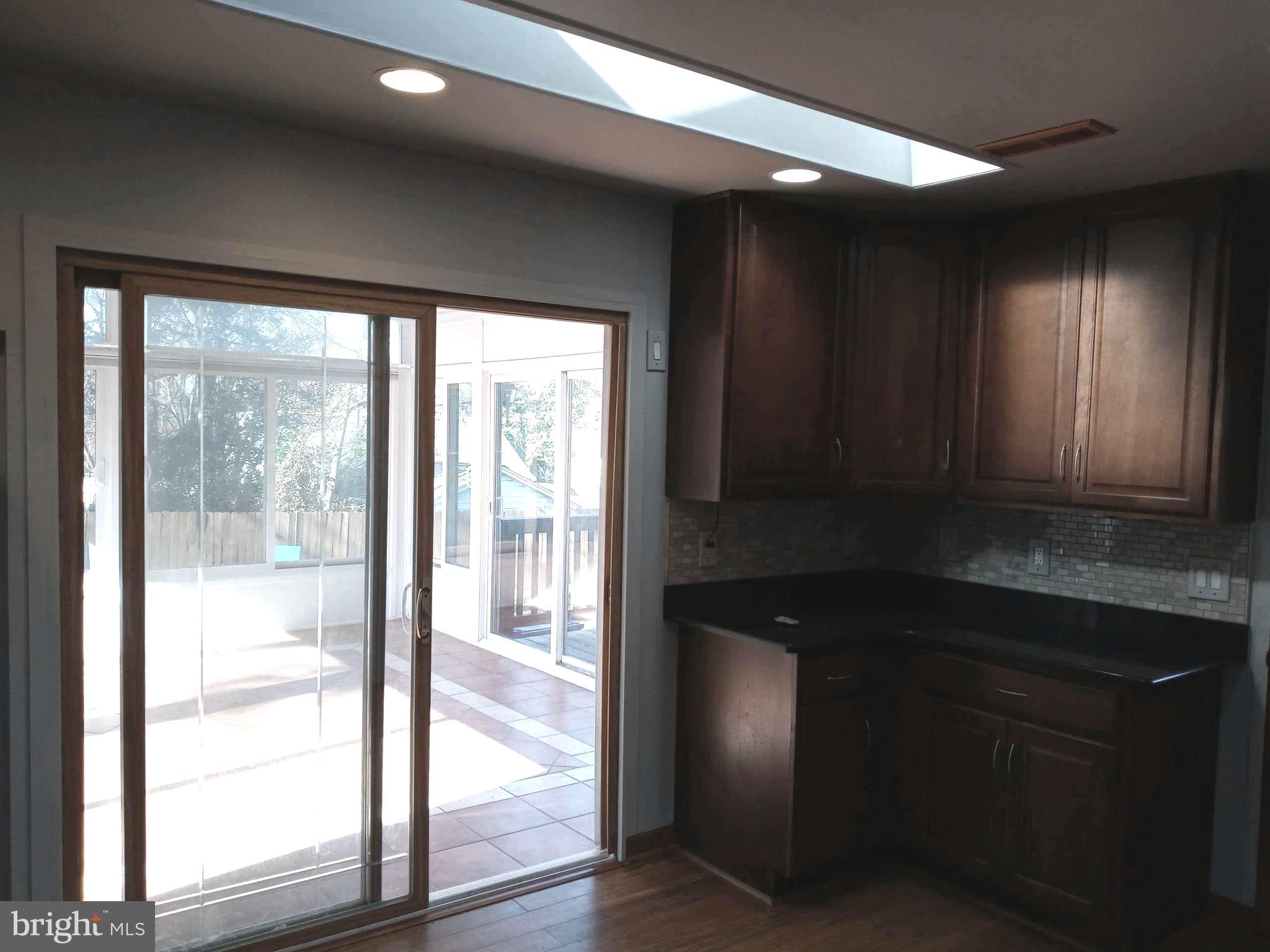12616 Epping Road Silver Spring, MD 20906 - Photo 8 of 28 a kitchen with a sink a window and cabinets