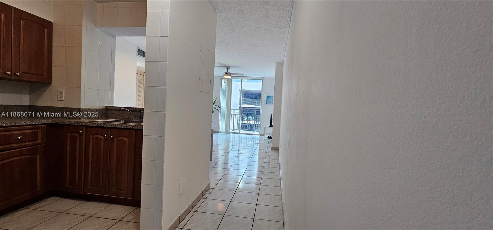501 Southwest 1st Street, Unit 507 Miami, FL 33130 - Photo 11 of 25 a view of a kitchen with white cabinets