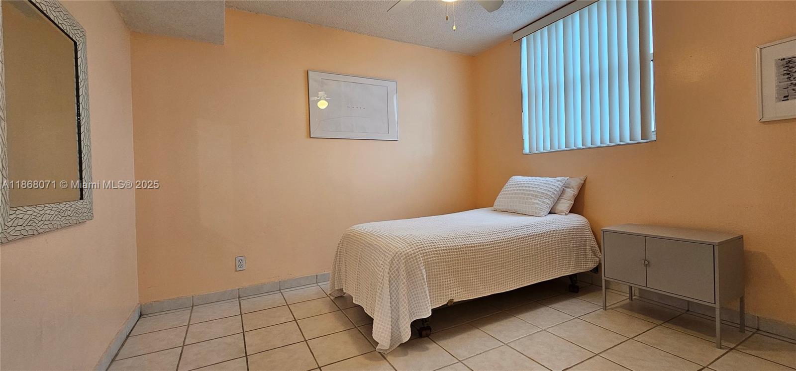501 Southwest 1st Street, Unit 507 Miami, FL 33130 - Photo 14 of 25 a bedroom with a bed and a window