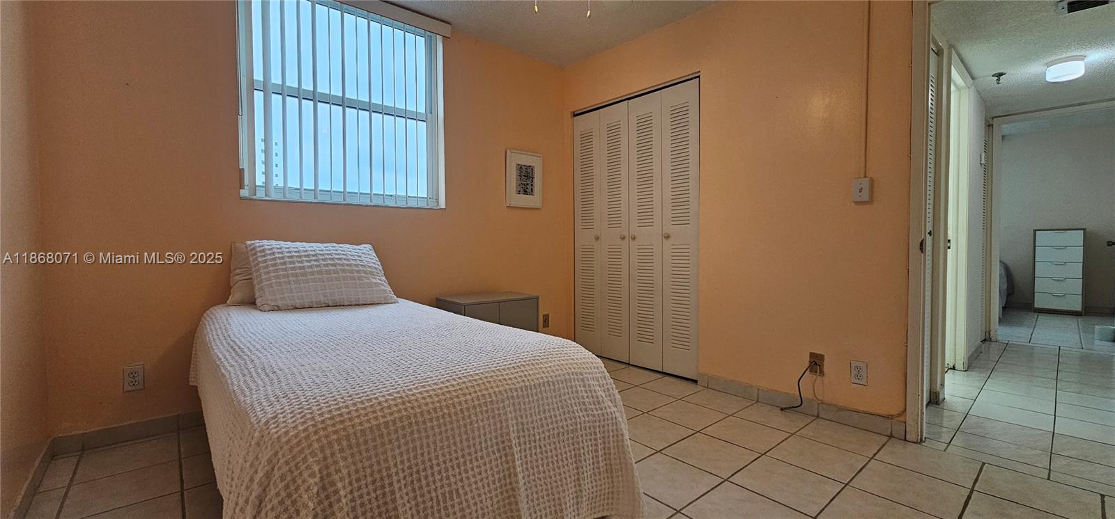 501 Southwest 1st Street, Unit 507 Miami, FL 33130 - Photo 15 of 25 a bedroom with a bed and a window