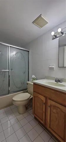 a bathroom with a toilet a sink and shower