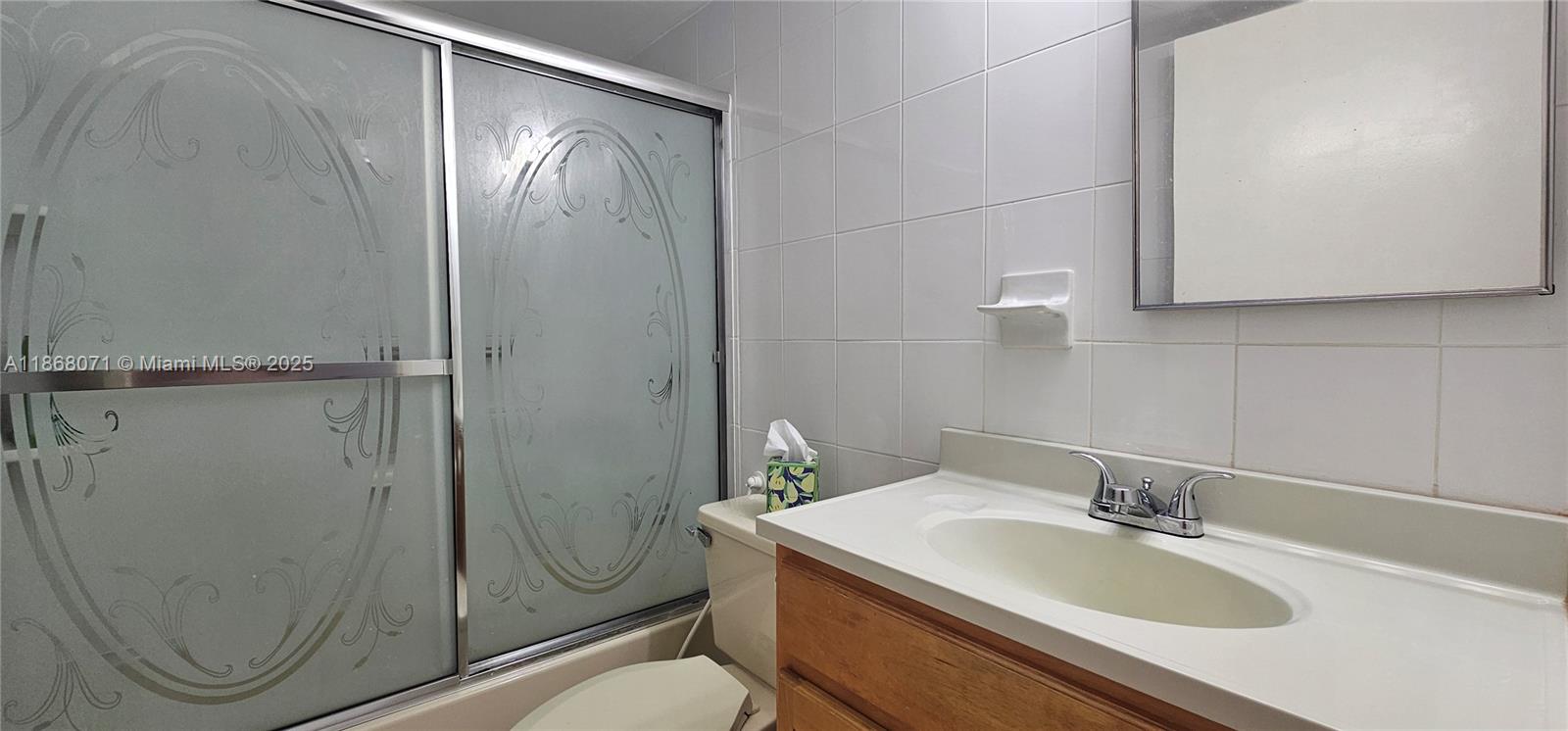 501 Southwest 1st Street, Unit 507 Miami, FL 33130 - Photo 17 of 25 a bathroom with a sink a toilet and shower