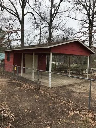 a house with trees in the background