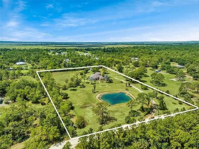 a view of a yard with a swimming pool