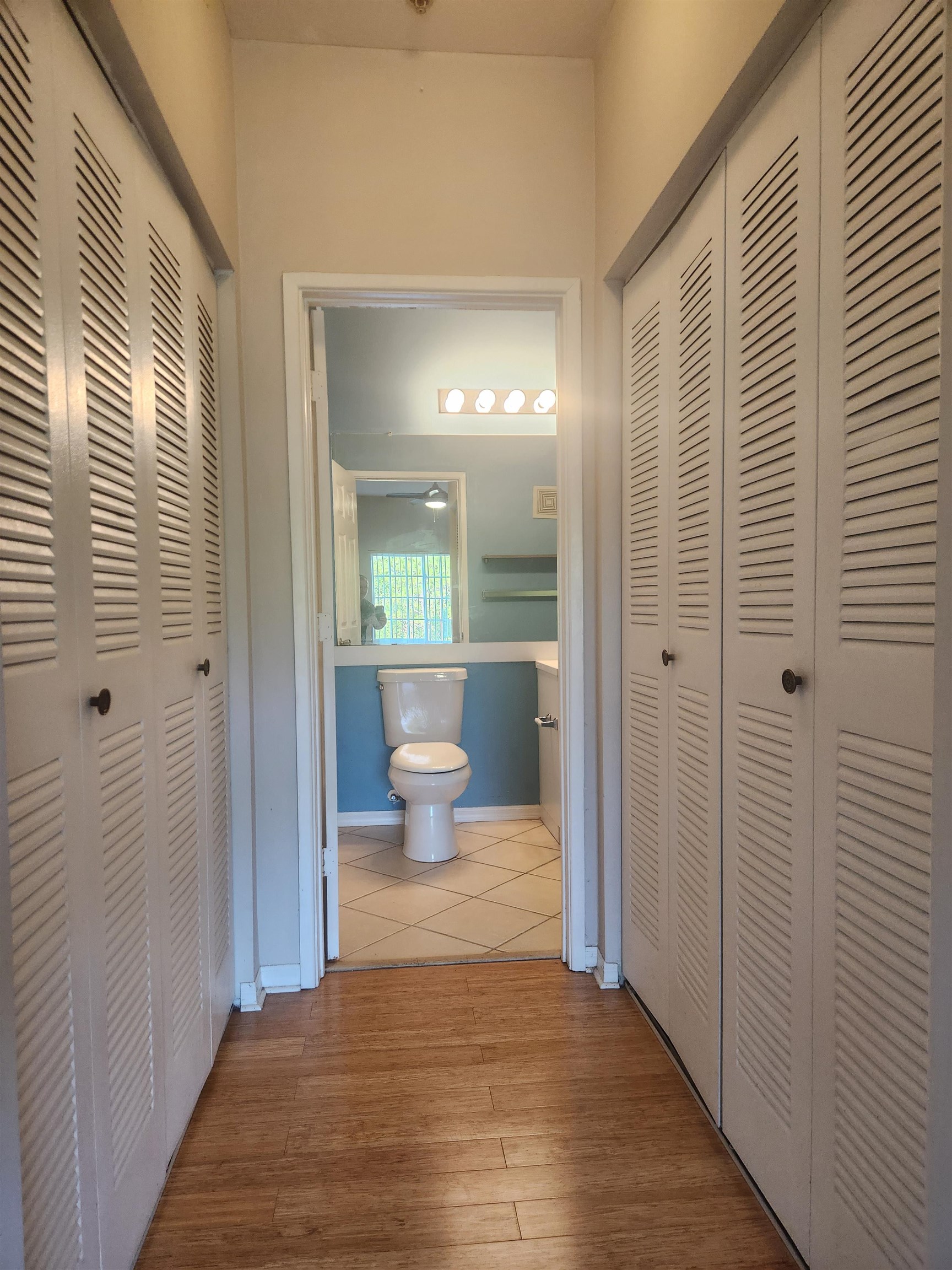 510 Florida Club Boulevard, Unit 304 St. Augustine, FL 32084 - Photo 12 of 24 a bathroom with a toilet and a glass door shower