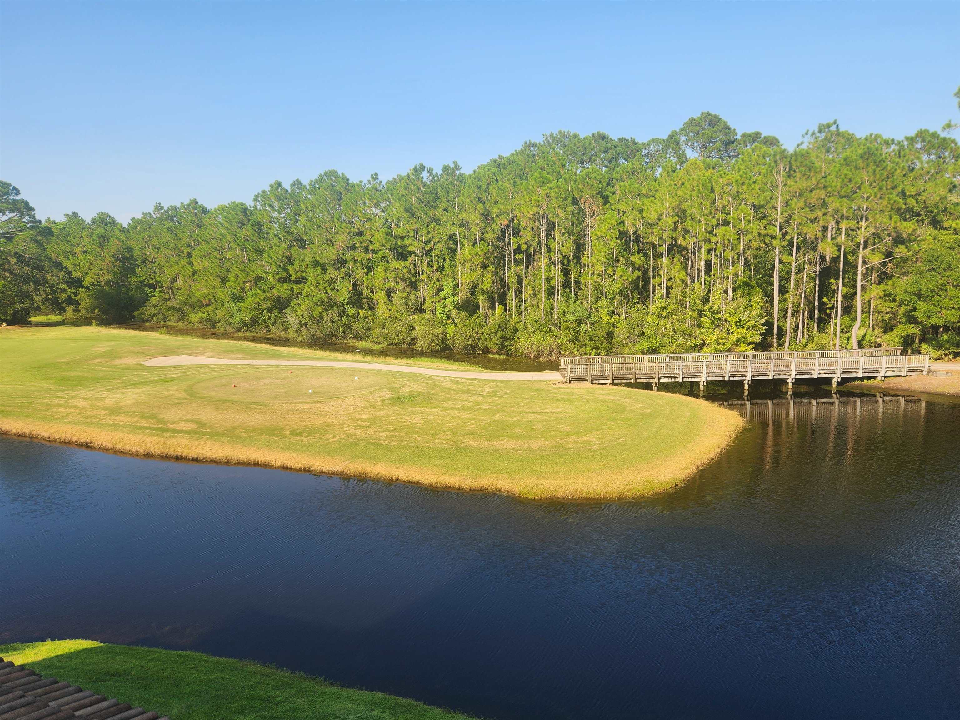 510 Florida Club Boulevard, Unit 304 St. Augustine, FL 32084 - Photo 19 of 24 a view of a lake with a mountain in the background