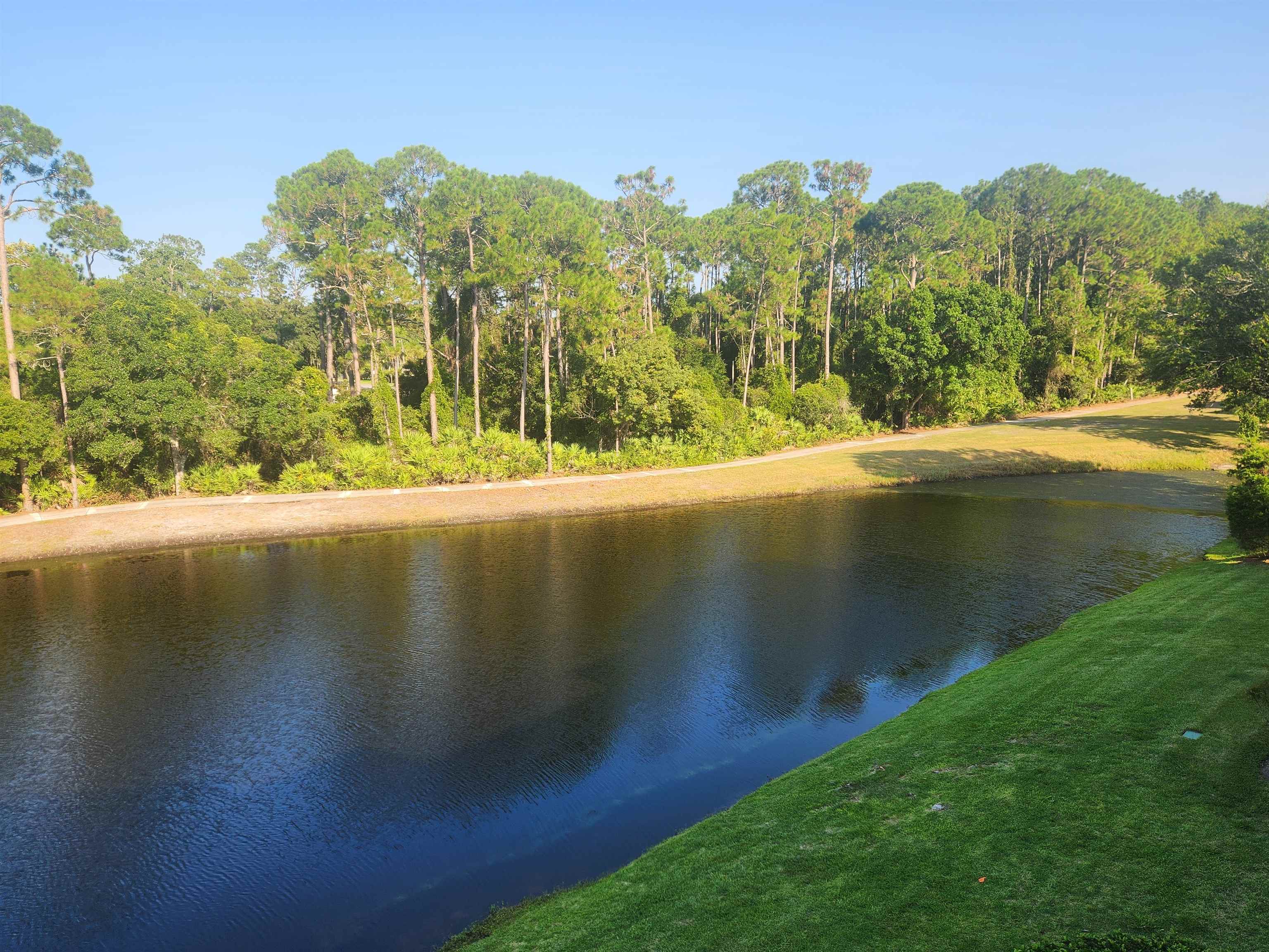 510 Florida Club Boulevard, Unit 304 St. Augustine, FL 32084 - Photo 20 of 24 a view of a lake with a mountain