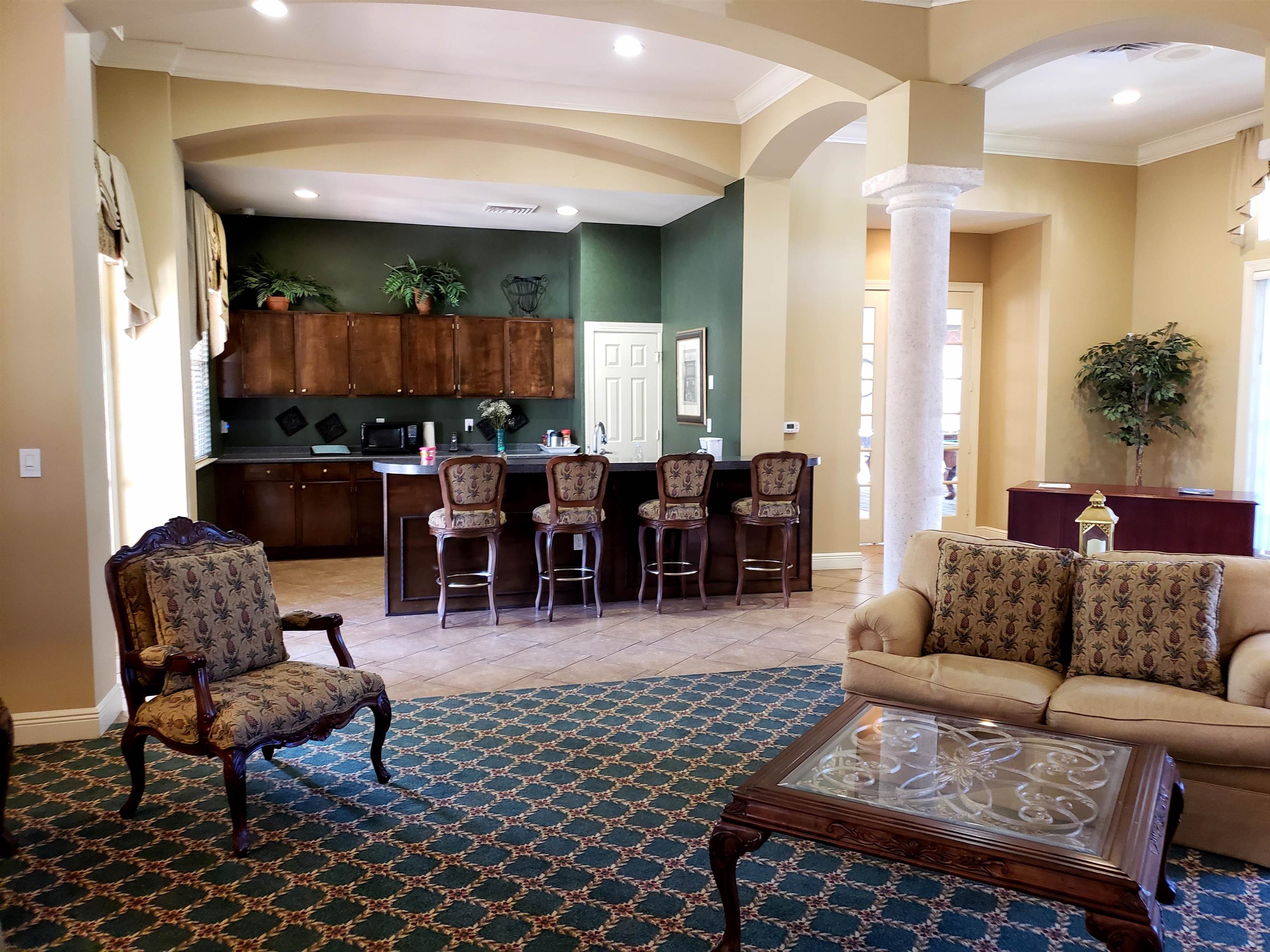 510 Florida Club Boulevard, Unit 304 St. Augustine, FL 32084 - Photo 23 of 24 a living room with furniture potted plant kitchen view and a window